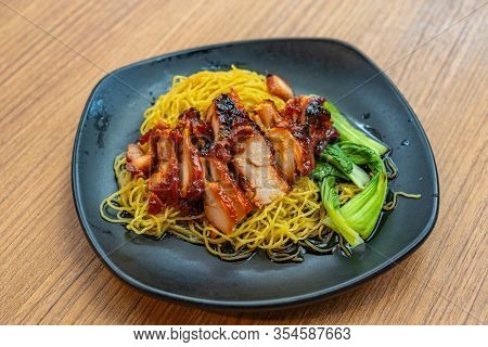 Plate Of Delicious Chinese Honey Grilled Pork Noodles- Char Siew
