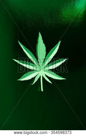 Cannabis Leaf Made Of Paper On Green Background