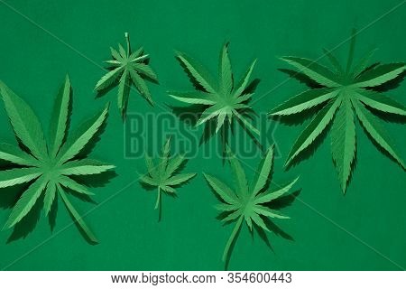 Cannabis Leaf Made Of Paper On Green Background
