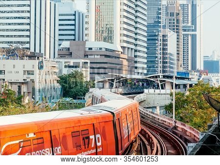 Bangkok, Thailand: Urban City Scene With Subway Station And Moving Train On Railroad On February 21,