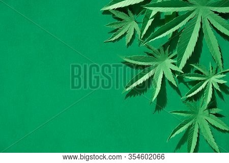 Cannabis Leaf Made Of Paper On Green Background