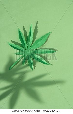 Cannabis Leaf Made Of Paper On Green Background