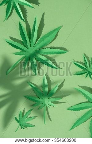 Cannabis Leaf Made Of Paper On Green Background