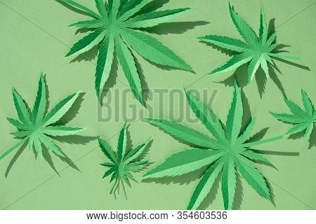 Cannabis Leaf Made Of Paper On Green Background