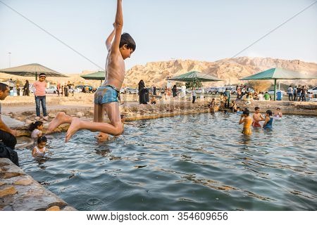 Children Playing In Green Mubazzarah Chalets, Al Ain, Abu Dhabi In 28/02/2014