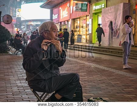 Changsha/china-17 October 2018:unacquainted Senior Street Performers Singing At Huangxing Walking St