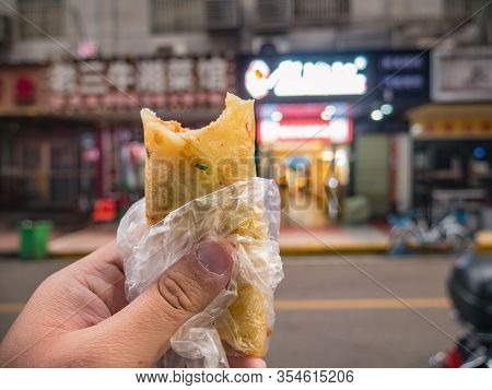 Close Up Jianbing In The Tourist Hand On The Street On The Road In Changsha City.jianbing Is The Chi
