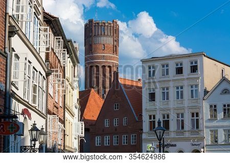 LÜneburg, Niedersachsen, Germany - Juli 27, 2018:
Half-timbered Red Brick Houses Near The River On T