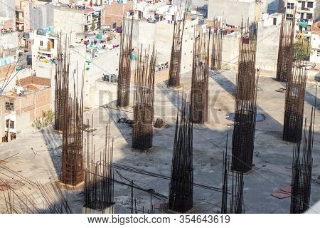 Construction Worker Concrete Pouring During Commercial Concreting Floors Of Building