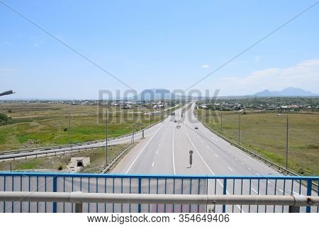 The Road Crossing Is Adjacent To The Secondary Road.