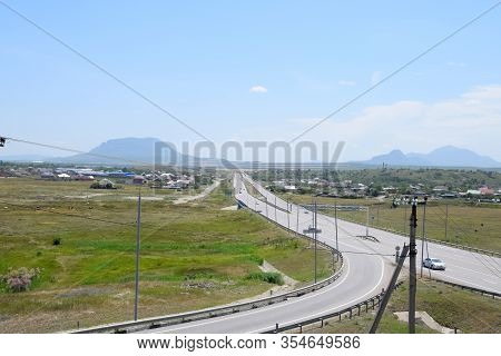 The Road Crossing Is Adjacent To The Secondary Road.