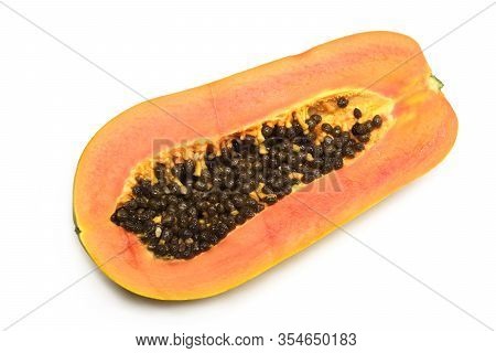 Half Cutted Off Ripe Tasty Papaya Fruit With Juicy Orange Pulp Indoor Studio Photo Isolated On White