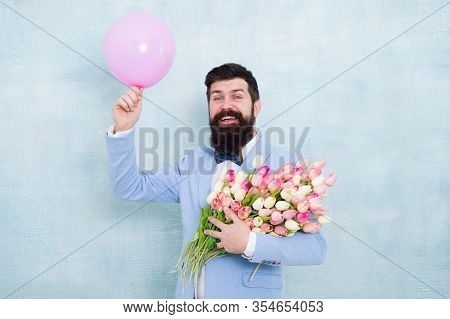 Art Of Charm. Happy Hipster Go Out On Date. Bearded Man Hold Tulips And Balloon. Perfect First Date 