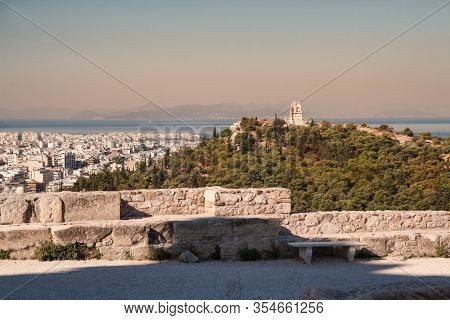 Athens Cityscape. View From The Acropolis To City, Philopappus Monument On Hill And The Aegean Sea E