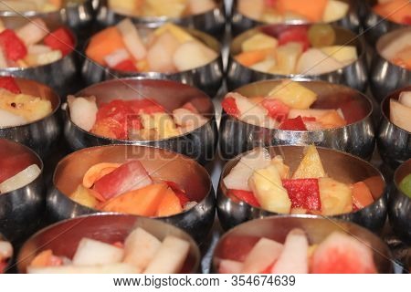 Fresh Fruit In Metal Bowls A Selfservice Cruise Ship Buffet: Melon, Pineapple And Grapes