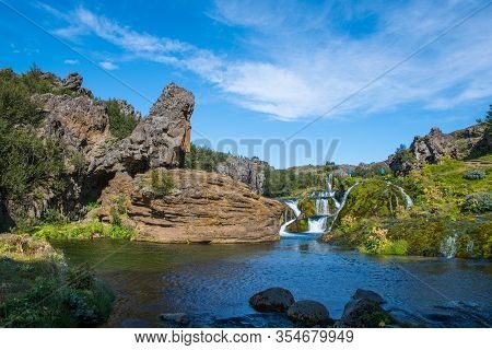 Thjorsardalur Iceland - August 9. 2019: Tourists Viewing Cascade Of Waterfall In Gjain Nature Spot