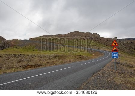 Icelandic Countryside Road In A Cloudy Summer Day