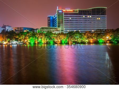 Guilin, China - May 9, 2010: Riyue Shuangta Cultural Park. Large Building With Lighted Lines Along T