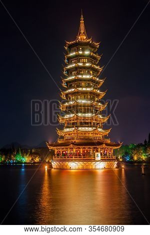 Guilin, China - May 9, 2010: Riyue Shuangta Cultural Park. Closeup Portrait Of Gold Pagoda In Shanhu
