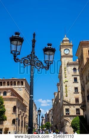 Salamanca, Spain - May, 2018: View Of The Beautiful Street Lamps And Antique Buildings At Zamora Str