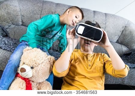 Cute, Little Boy Having Fun With Vr Headset With His Brother Next To Him And Teddy Bear Toy. Kids An