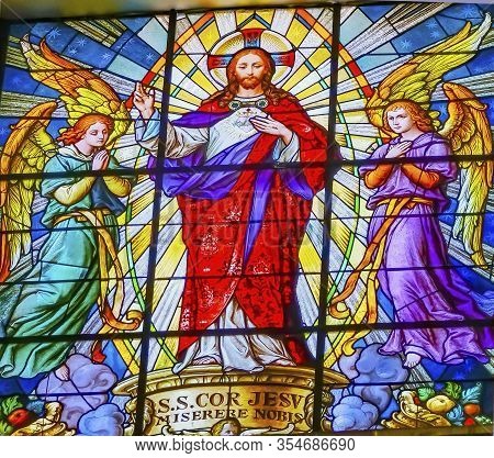 Puebla, Mexico - January 5, 2019 Colorful Jesus Archangels Stained Glass Basilica Cathedral Puebla M