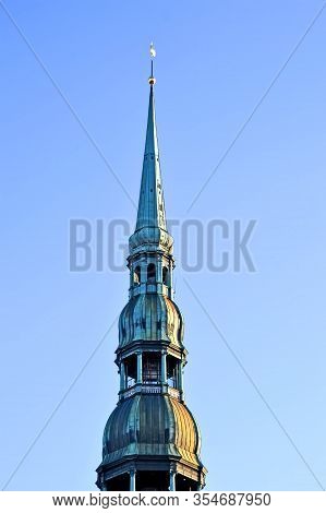 Heritage Copper Spire Aka Spile On The Vintage Building Roof On Blue Sky In Sunny Day, Travel Divers
