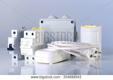 Electrical Equipment On Gray Background. Electrical Component For Repair Of Home.