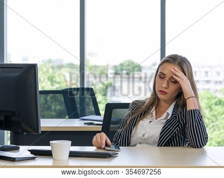 Morning Work Atmosphere In A Modern Office. Teen Employees Rest Their Eyes Due To Dizziness And Head