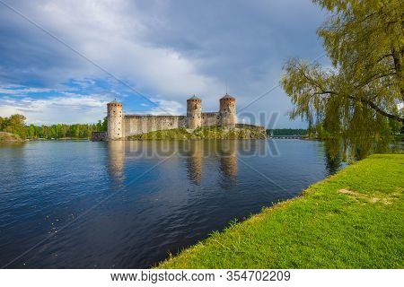 View Of The Old Olavinlinna Fortress On A Cloudy June Day. Savonlinna, Finland