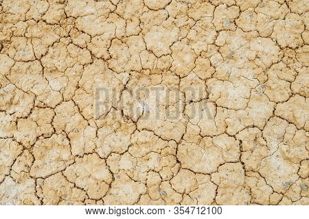 Nature Background Of Cracked Dry Lands. Natural Texture Of Soil With Cracks. Broken Clay Surface Of 