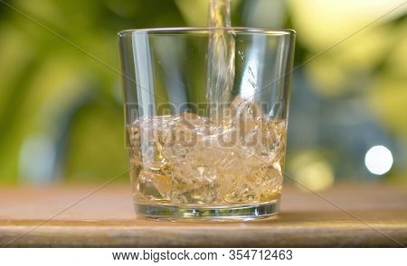 Glass Of Apple Juice Pouring