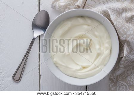 Yogurt Bowl With Natual Creamy White Greek Yoghurt On White Rustic Table Close Up  - Photo Taken Fro