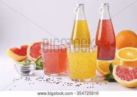 Trendy Tropical Orange And Grapefruit Juice With Basil Seeds Or Falooda Seeds Or Tukmaria In Bottle 