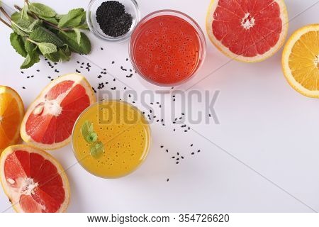 Trendy Tropical Orange And Grapefruit Juice With Basil Seeds Or Falooda Seeds Or Tukmaria In Glass O