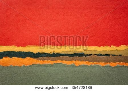 red sunset or sunrise abstract landscape in red and yellow tones - a collection of colorful handmade Indian papers produced from recycled cotton fabric