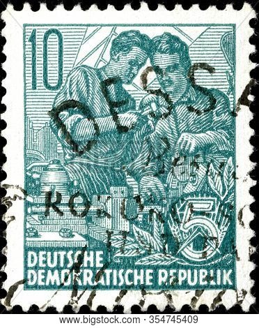 02.11.2020 Divnoe Stavropol Territory Russia The Postage Stamp Gdr 1953 Five-year Plan Two Workers