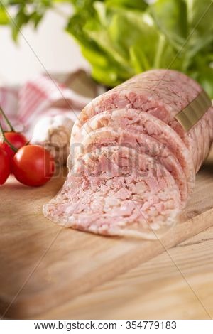 Headcheese On Wooden Cutting Board. Brawn. Pork Cold Cuts.