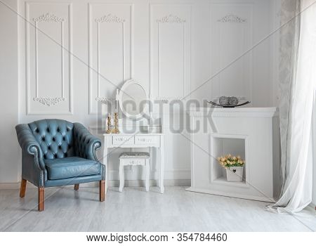 White Room With Blue Retro Chair And Mirror.