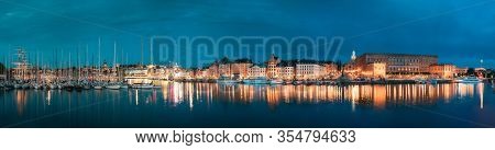 Stockholm, Sweden. Scenic Famous View Of Embankment In Old Town Of Stockholm In Night Lights. Gamla 