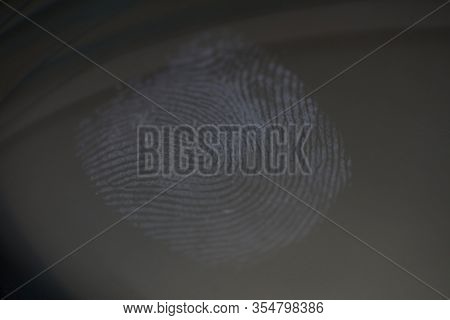 Fingerprint Mark On Clear Glass As Crime Evidence Close-up