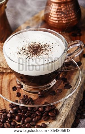 Cappuccino Is An Espresso-based Coffee Drink And Steamed Milk Foam Made From Coffee In A Transparent