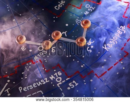 The constellation Cassiopeia is made of donuts on a map of the starry sky. Cosmic nebula. Conceptual photo. National Doughnut Day, Sweetest Day.