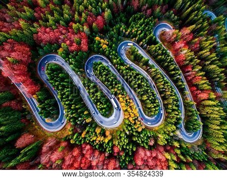 Beautiful Aerial View Of A Curvy Winding Road With Serpentine And Colorful Autumn Trees, Cheia, Dn1a