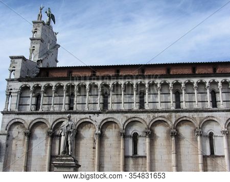 Side View Of Roman Catholic Basilica Church Of San Michele In Foro And Francesco Burlamacchi Statue 