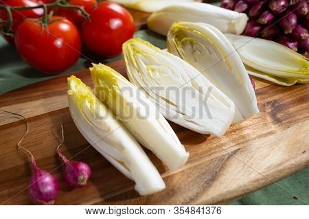Fresh Belgian Endive Or Chicory Bitter Salad Ready To Cook Or Eat