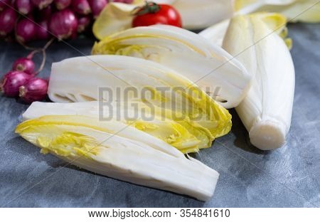 Fresh Belgian Endive Or Chicory Bitter Salad Ready To Cook Or Eat Close Up