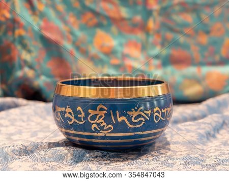 Haulerwijk - March 07 2020: Haulerwijk, The Netherlands. Blue And Golden Singing Bowl Made Of Seven 