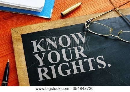 Redundancy Concept. Know Your Rights Sign On The Blackboard.