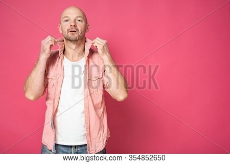 Egocentric, Handsome Man Straightens The Collar Of His Shirt And Looks Pompously At The Camera. Copy